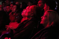 a group of people watching a concert