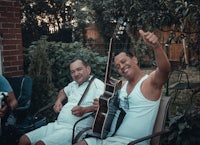 a man holding a guitar